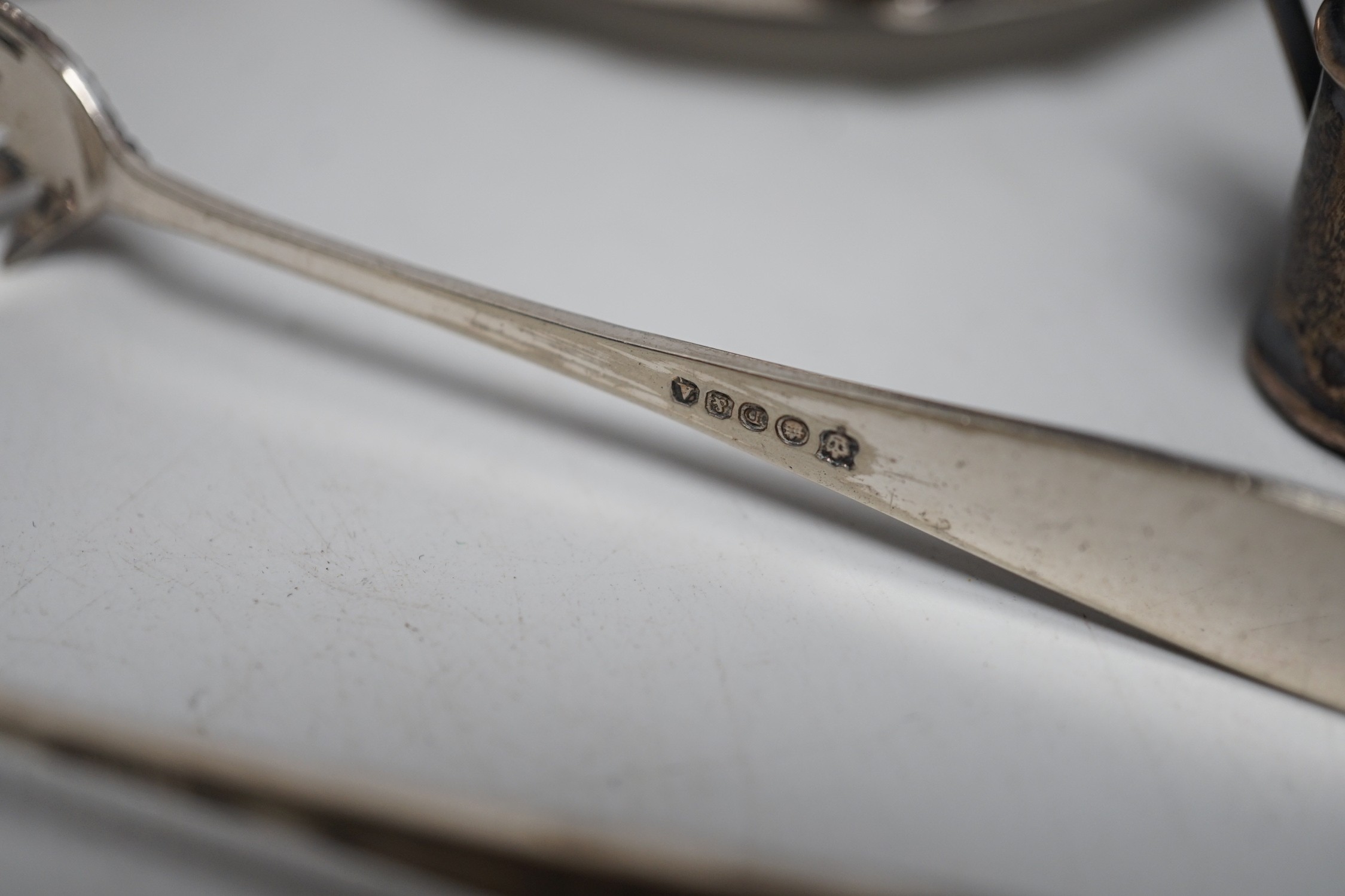 Sundry small silver including four salts by Mappin & Webb, three mounted dwarf candlesticks, two white metal Egyptian dishes and a white metal tazza, eight other items including two 19th century caddy spoons and four pla